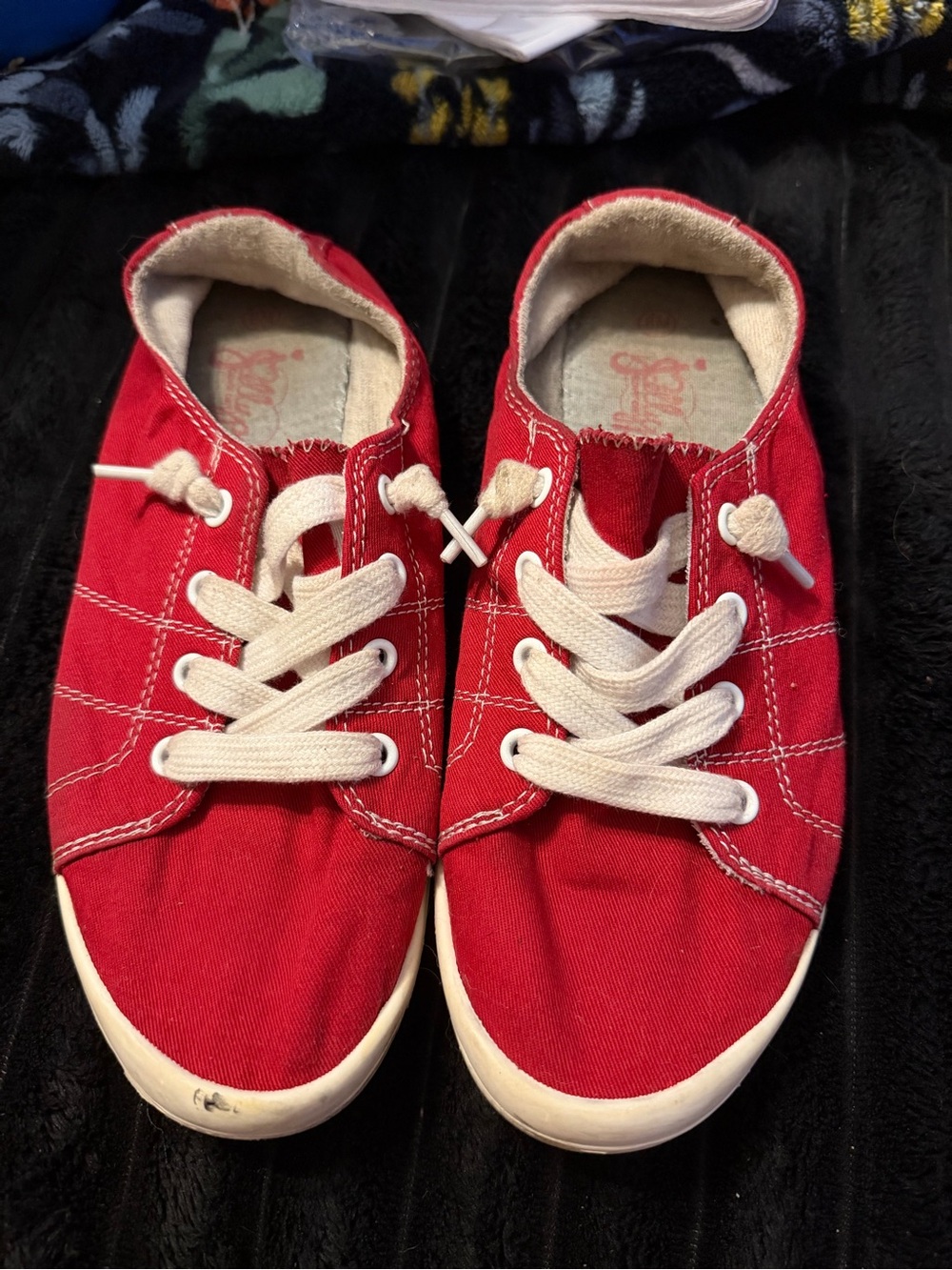 Red canvas sneakers with white stitching size 8